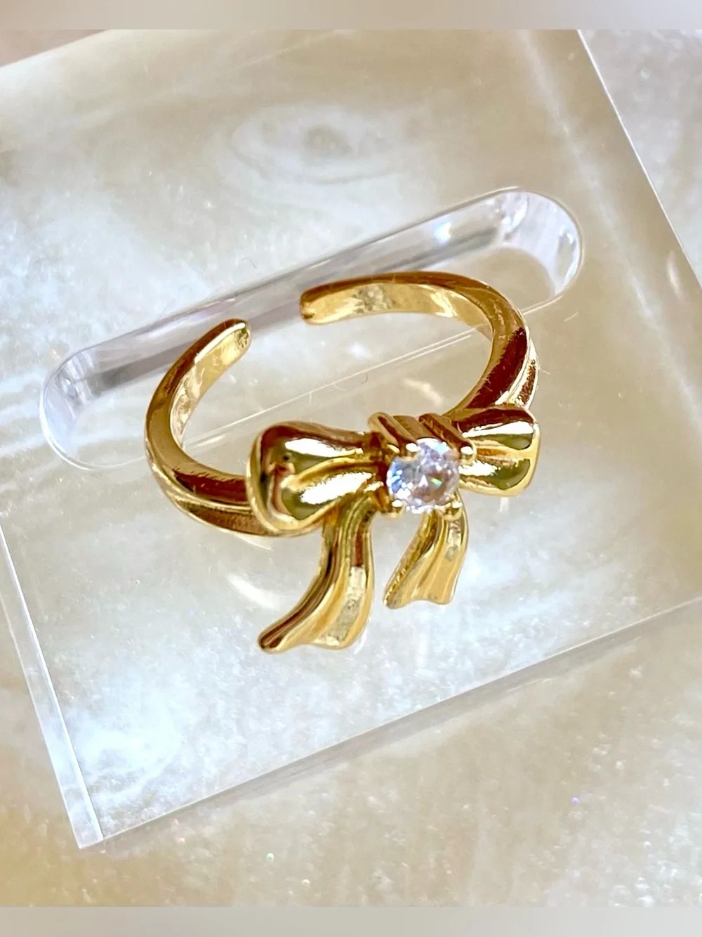 Gold Bow Ring with Clear Stone Accent